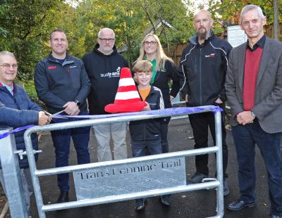  Image of Councillor Hans Mundry joining officers from the council and Sustrans to cut a ribbon at the Trans Pennine Trail in Lymm.