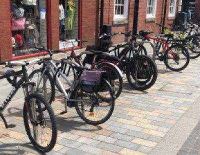 Row of bicycles locked onto bike railings
