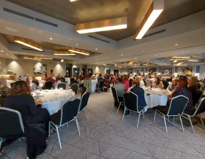 Raising a cuppa to fostering communities (inked) 1 afternoon tea event underway, full room.jpg