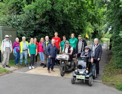Image of Cllr Hans Mundry standing on the Trans Pennine Trail in Lymm with members of the Friends of the Trans Pennine Trail.