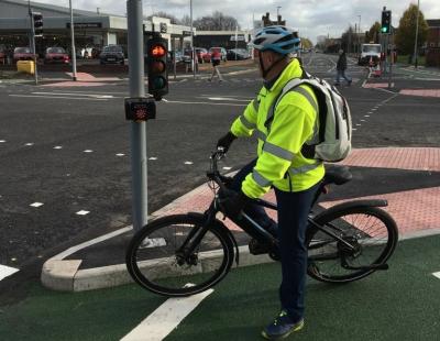 An image of a cyclist waiting at the lights at the new CYCLOPS junction in Warrington.
